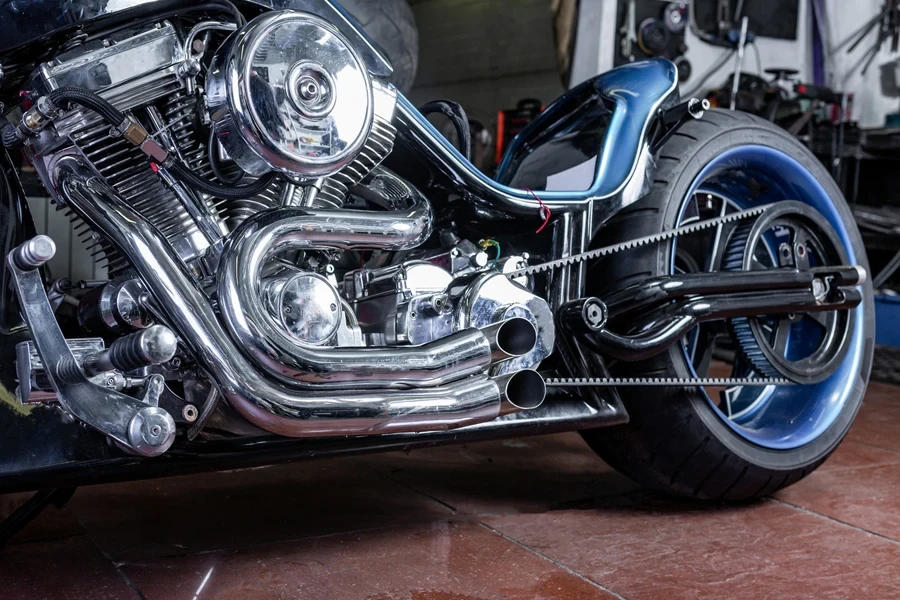 Motorcycle in workshop with modified exhaust