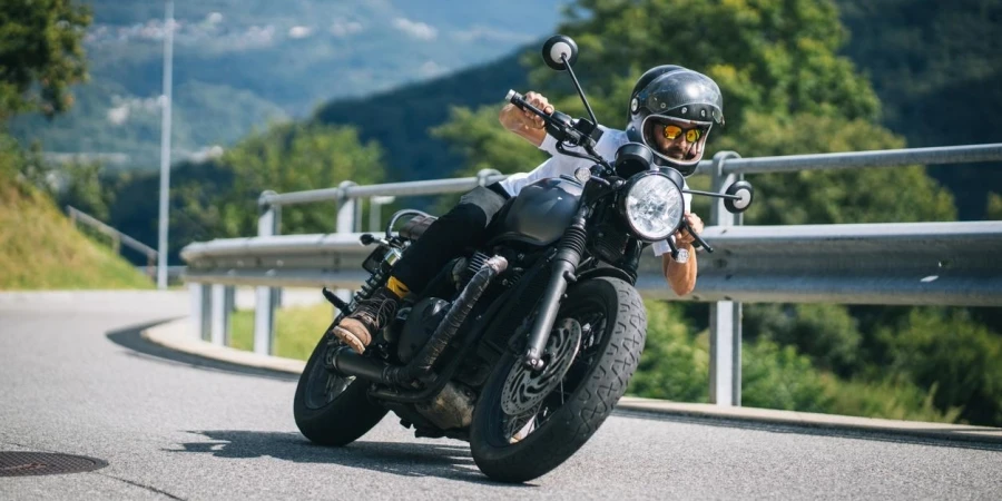 Motorcyclist Rides Mountain Road