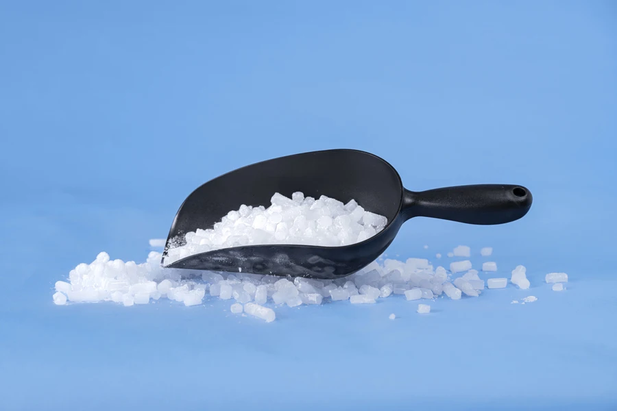 Multiple dry ice pellets on a blue background