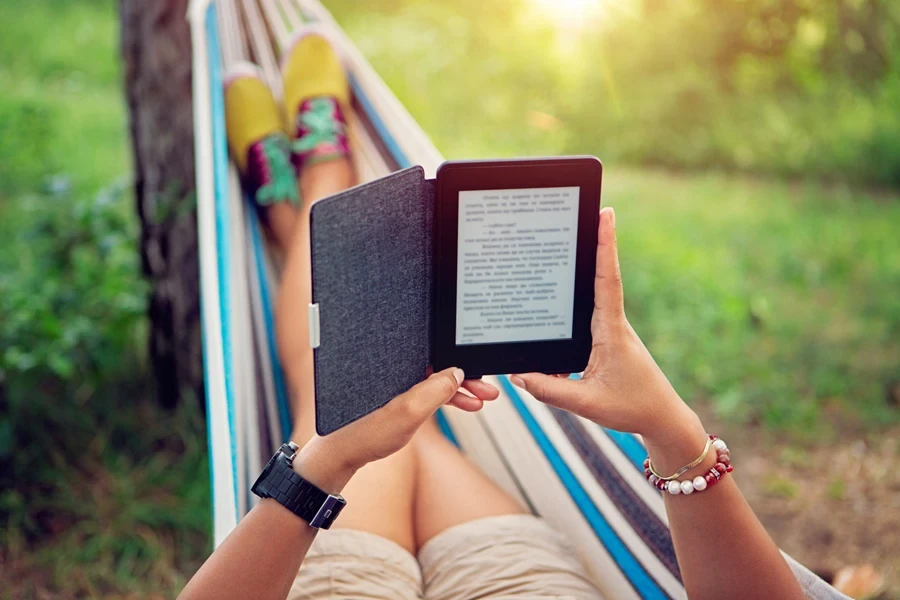 Person in a hammock reading an ebook