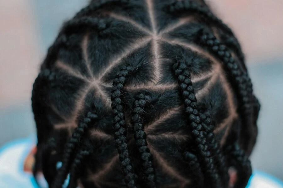 Person’s head with pop smoke braids