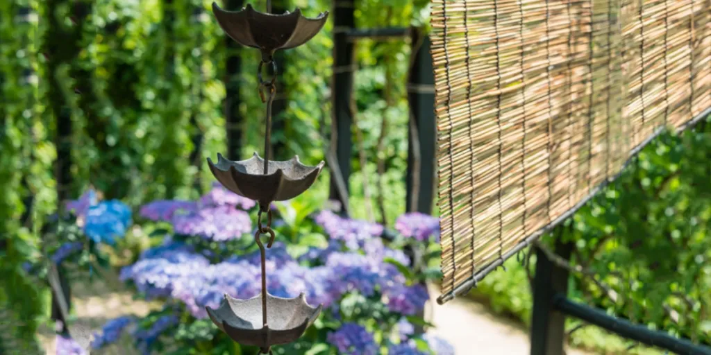 Rain chains and a bamboo shade in a Japanese garden