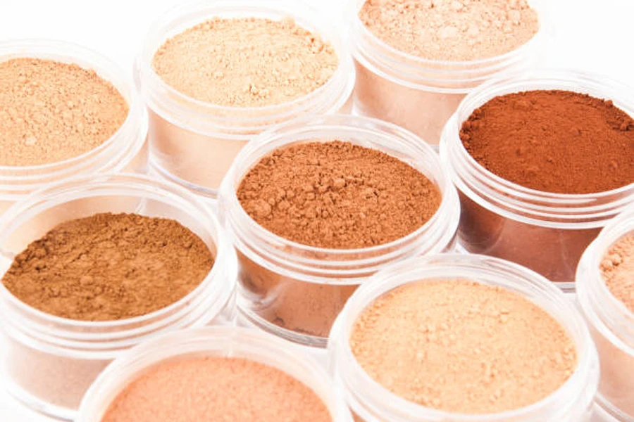 Selection of mineral foundation powder in small plastic jars