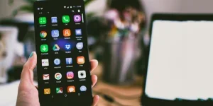 Selective Focus Photography of Person Holding Turned on Smartphone