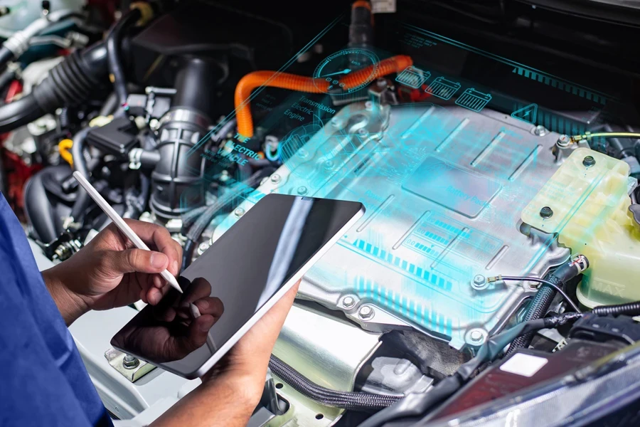 Technician diagnosing an electric car