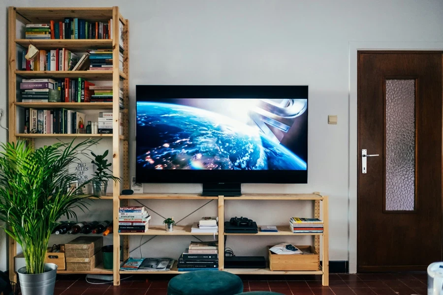 Television on book shelf in living room