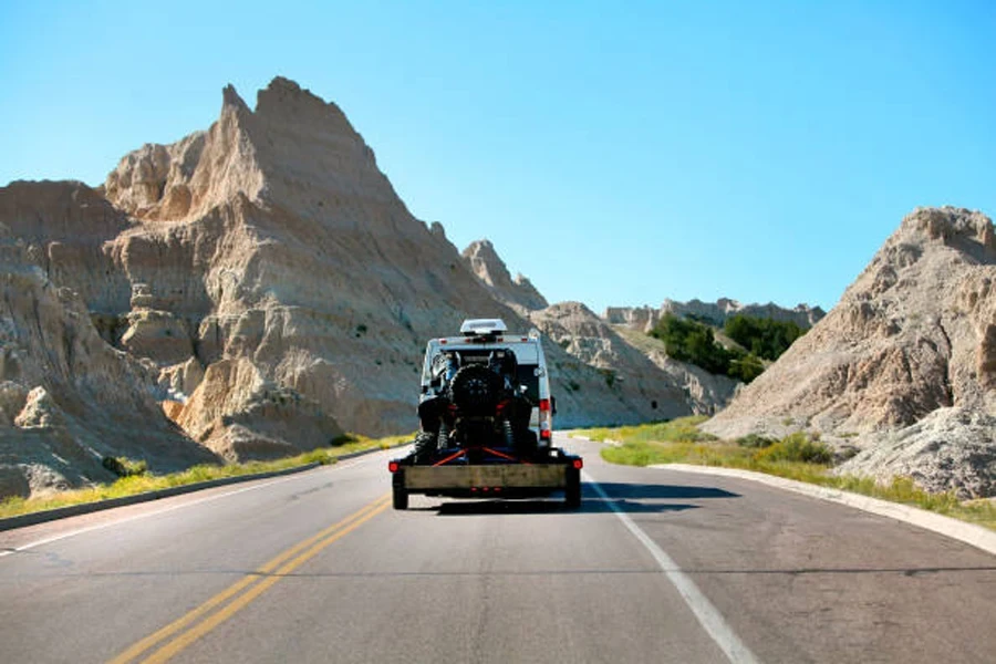 Traveling behind an Adventure Van pulling a trailer with an off road vehicle