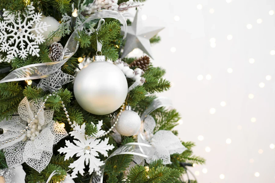 Various beautiful white decorations on a Christmas tree