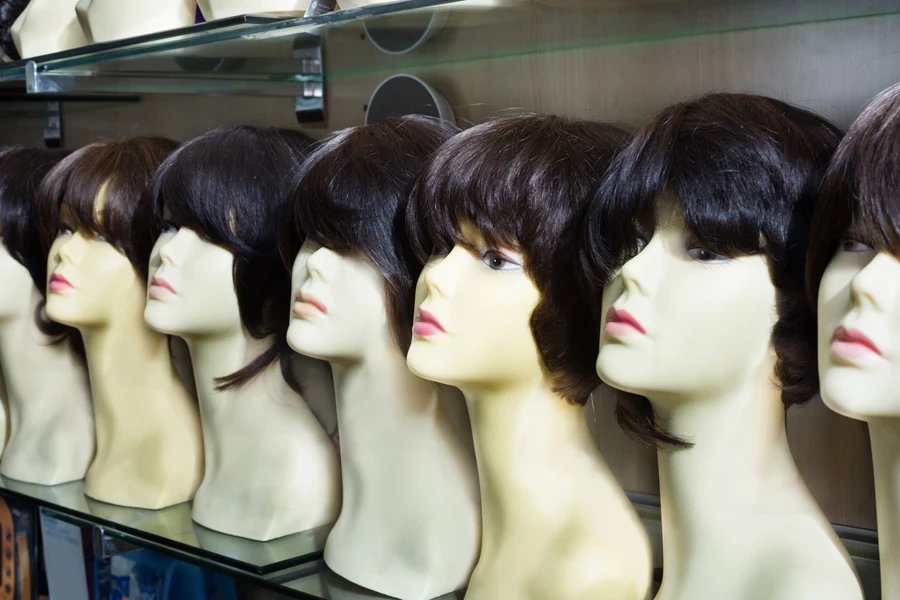 Wigs on a store shelf