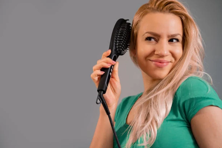 Woman Using Electric Comb at Home