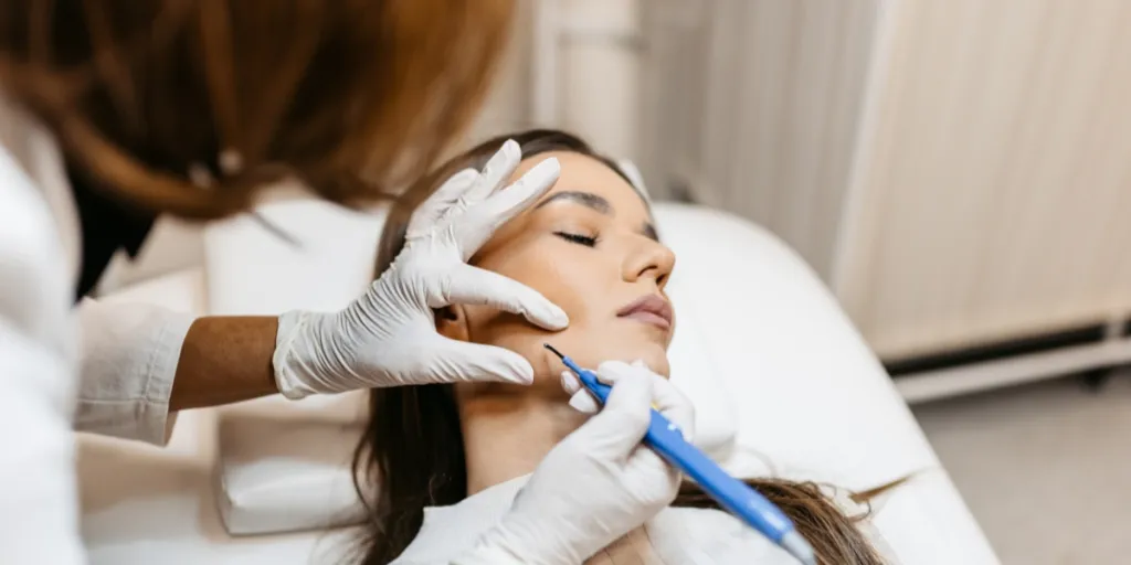 Woman getting a blackhead removal treatment