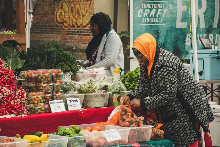 Woman packing fruits at an outdoor market