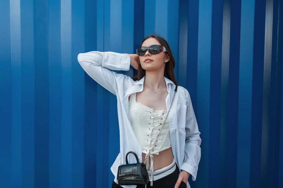 Woman posing in a white corset top