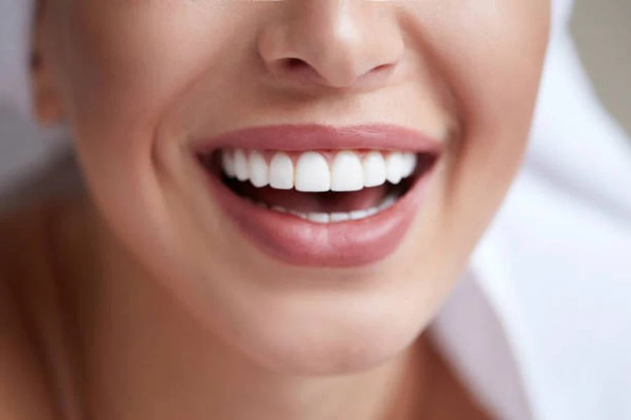 Woman with light skin tone wearing pale pink lipstick