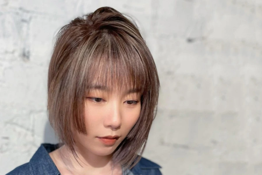 Young Japanese woman with hime cut put in ponytail