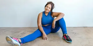 A plus-size woman in blue activewear