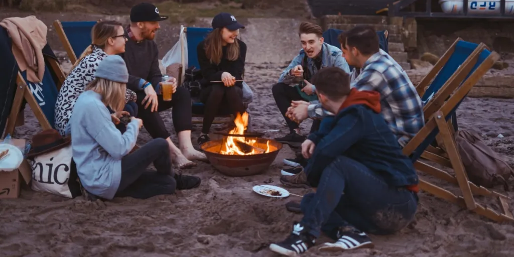 friends sitting around a fire pit