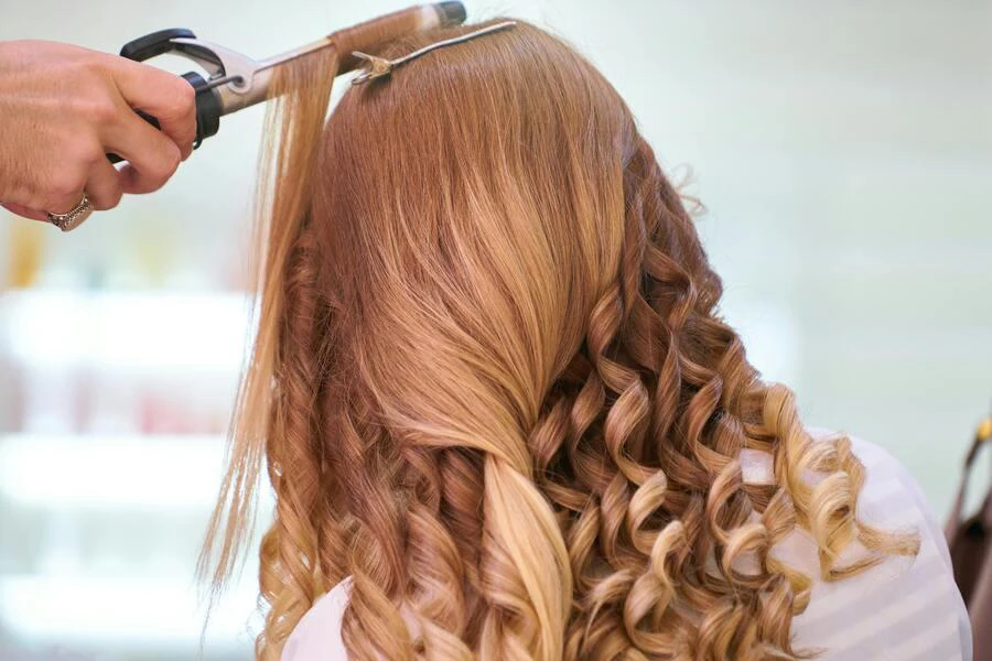 hands of a person styling hair