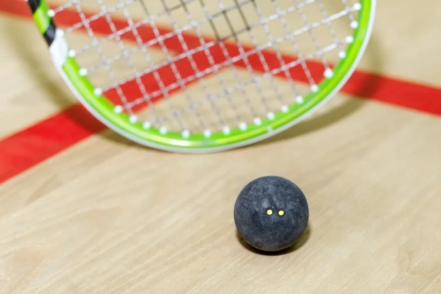 a squash racket and ball