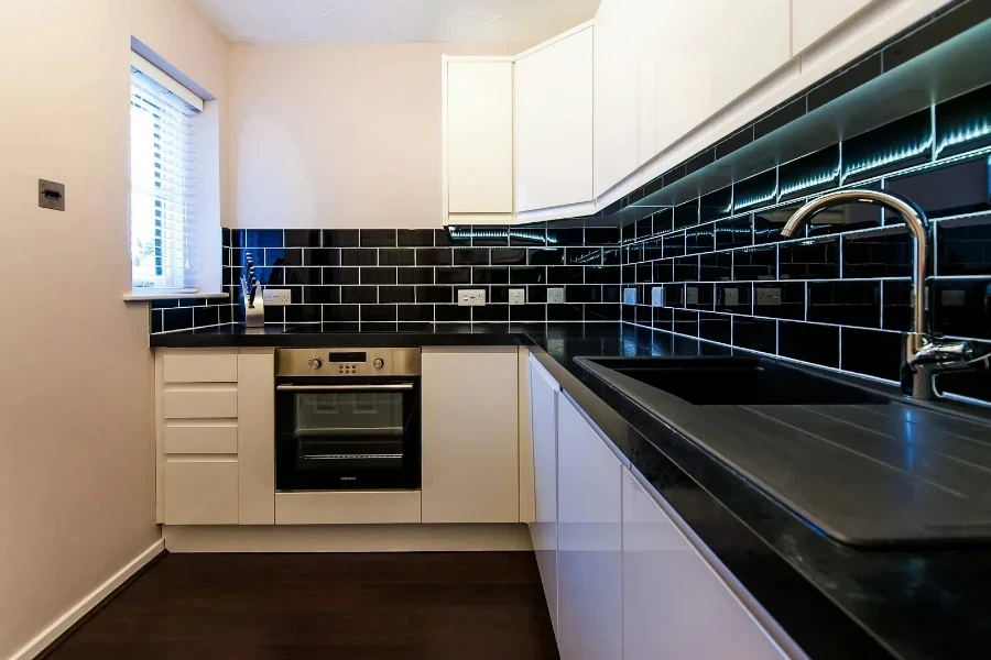 kitchen with black subway tiles