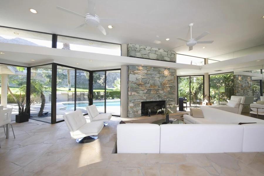 sunken living room with white sofas