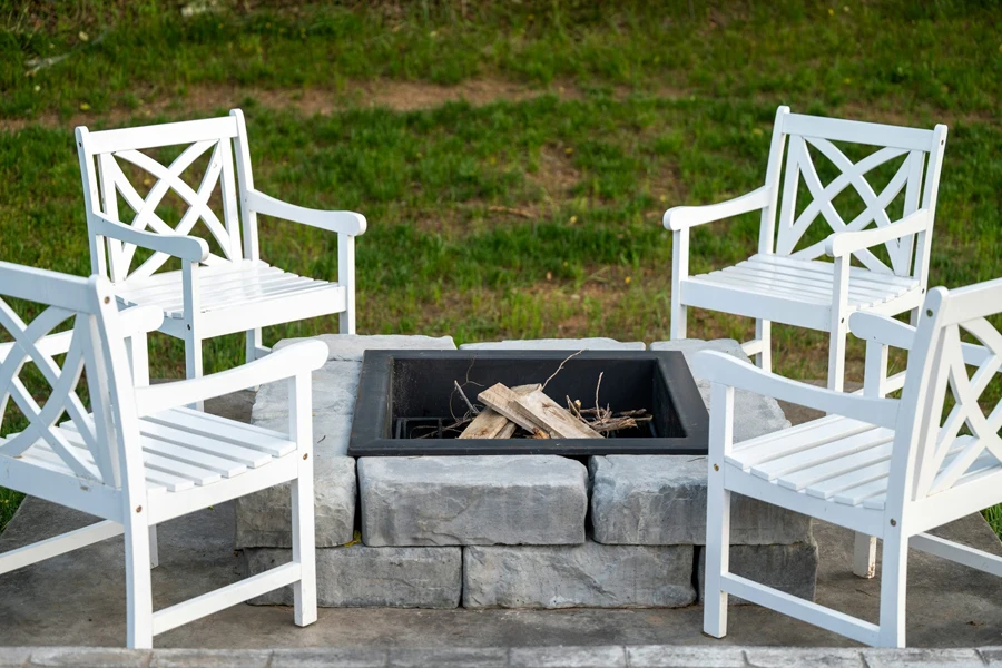 white stone fire pit with wood