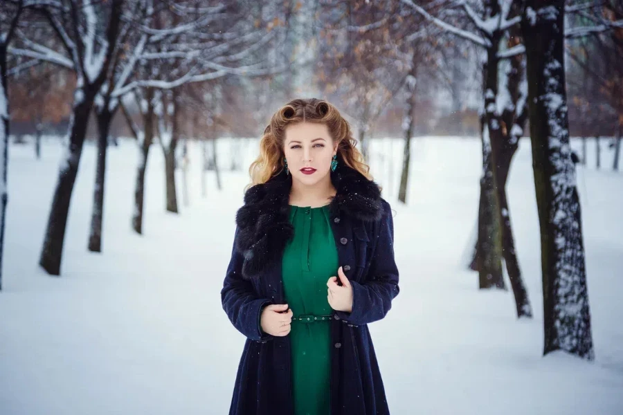 Woman in a black faux-fur lined parka