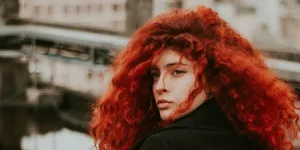 woman with curly copper hair