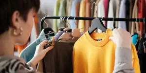 young woman looking at clothes