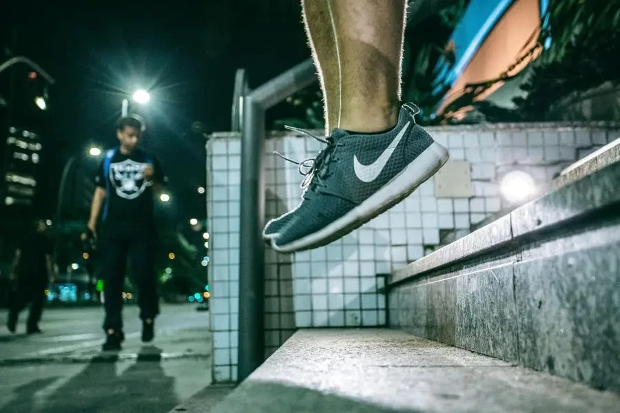 Captivating urban night scene with a person jumping, showcasing active lifestyle and movement