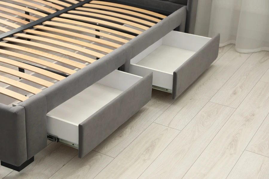 A bed frame with slide storage boxes