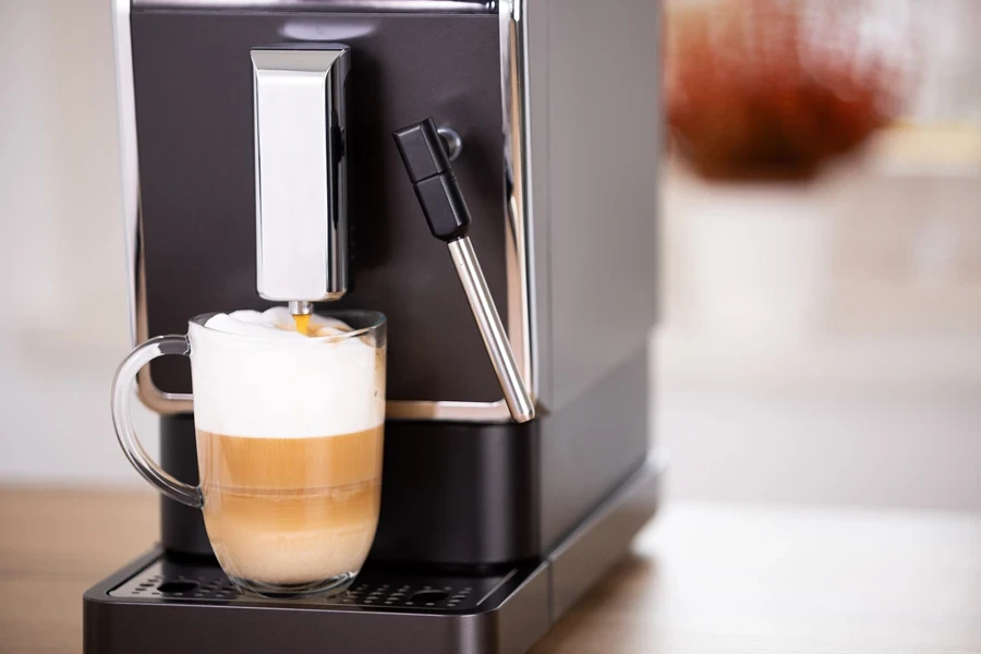 A black automatic espresso machine in action