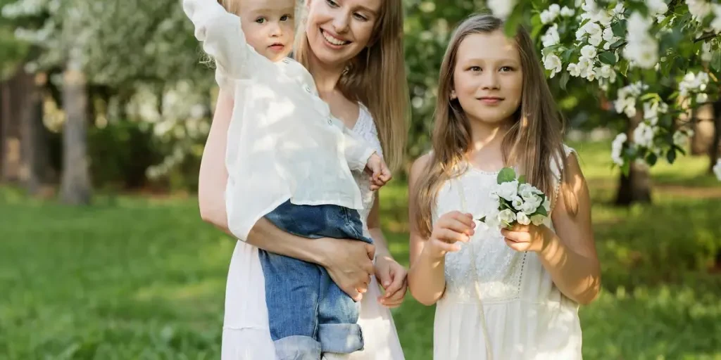 A joyful family moment with mother and children in a blooming park