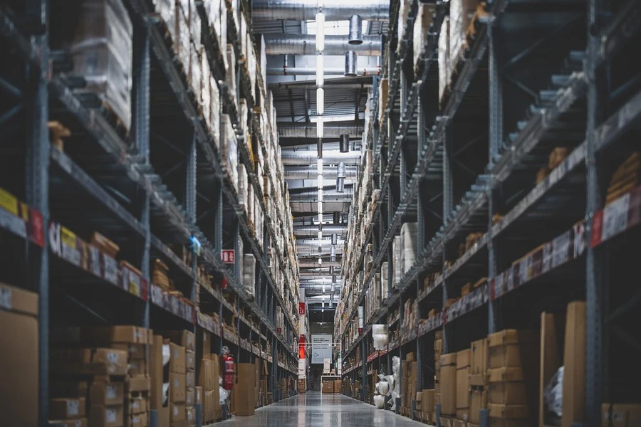 A warehouse with shelves stacked with boxes