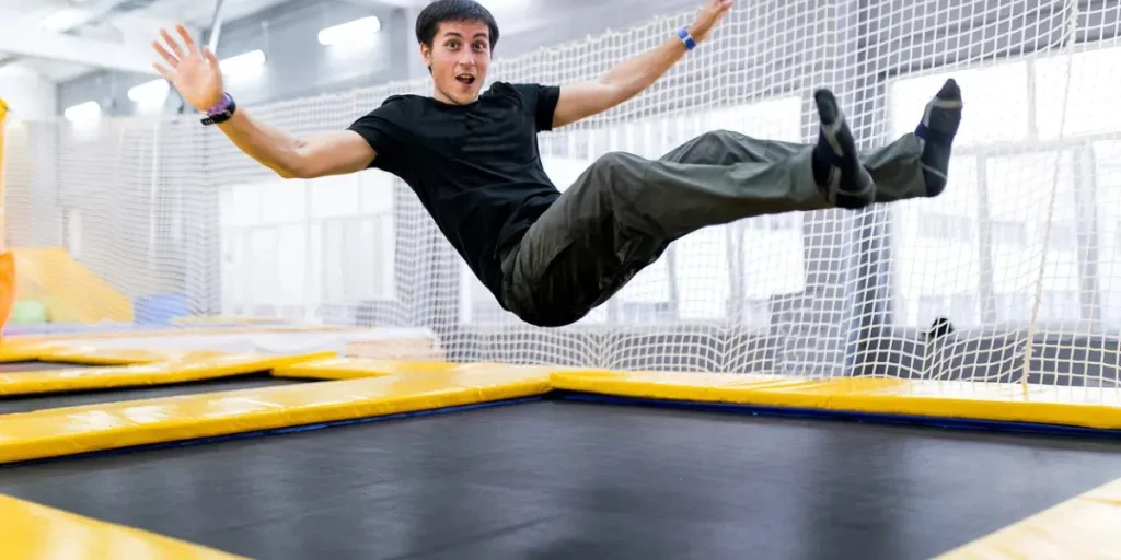 A young man trampolining in fly park