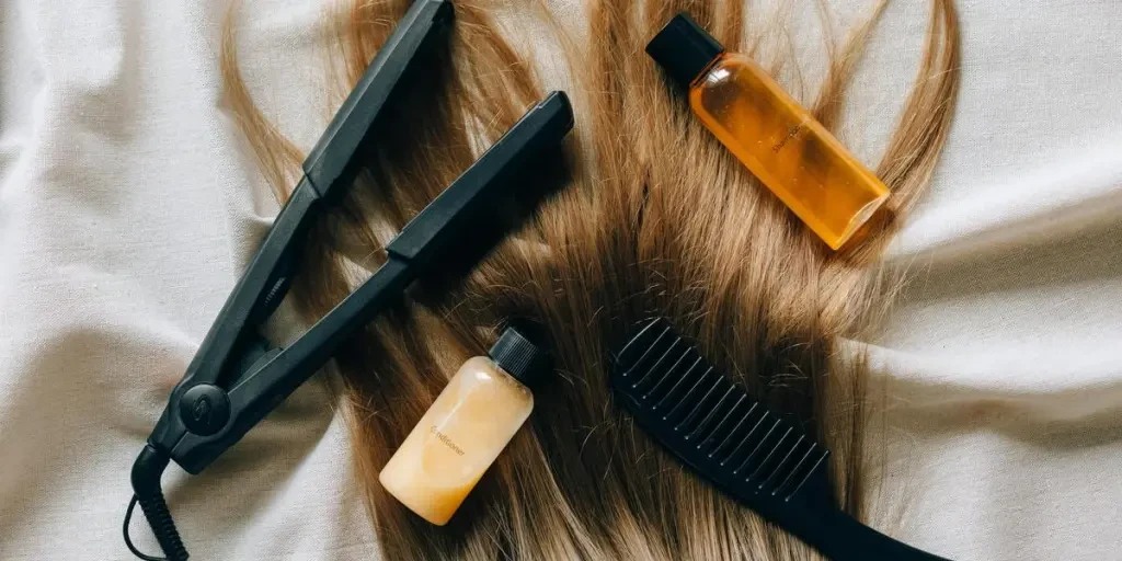 Aesthetic flat lay of hair products and tools for styling and grooming