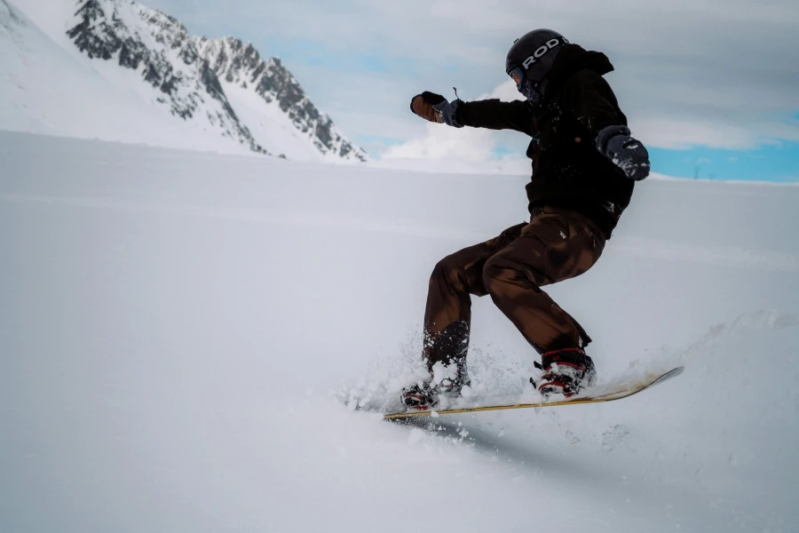 An adventurous snowboarder carving through snow in Saint-François-Longchamp, showcasing winter sports enthusiasm