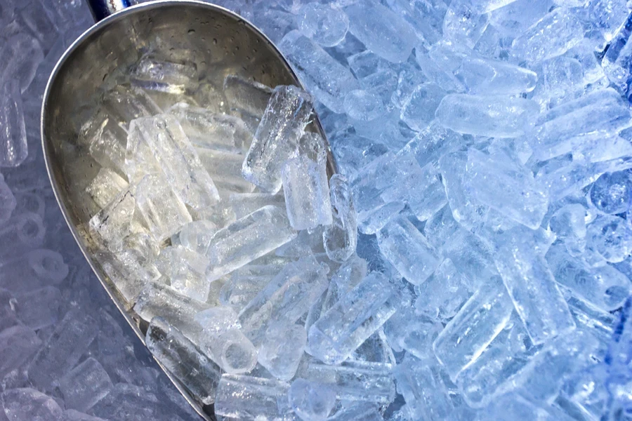 An aluminum scoop getting some ice