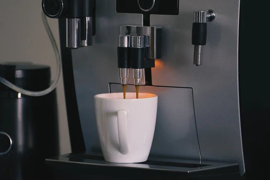 An automatic espresso machine filling a cup with coffee