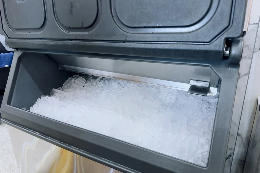 An ice machine filled with ice cubes