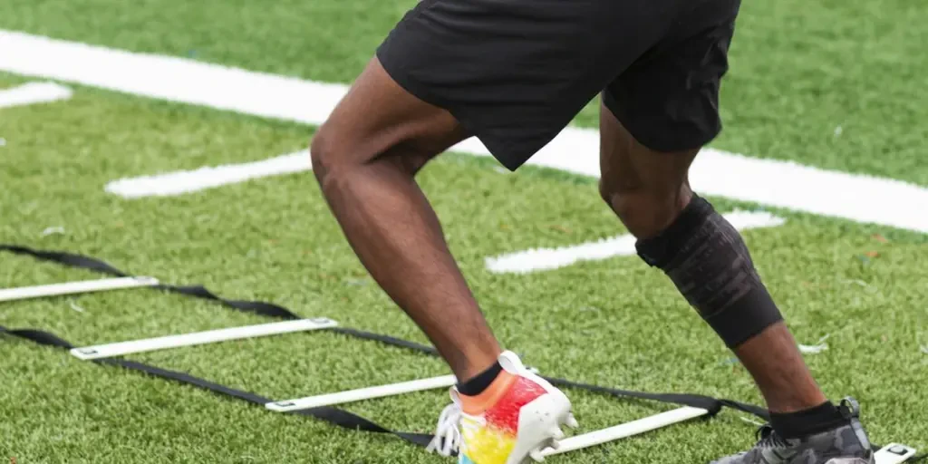 Athlete performing ladder drills on sports field