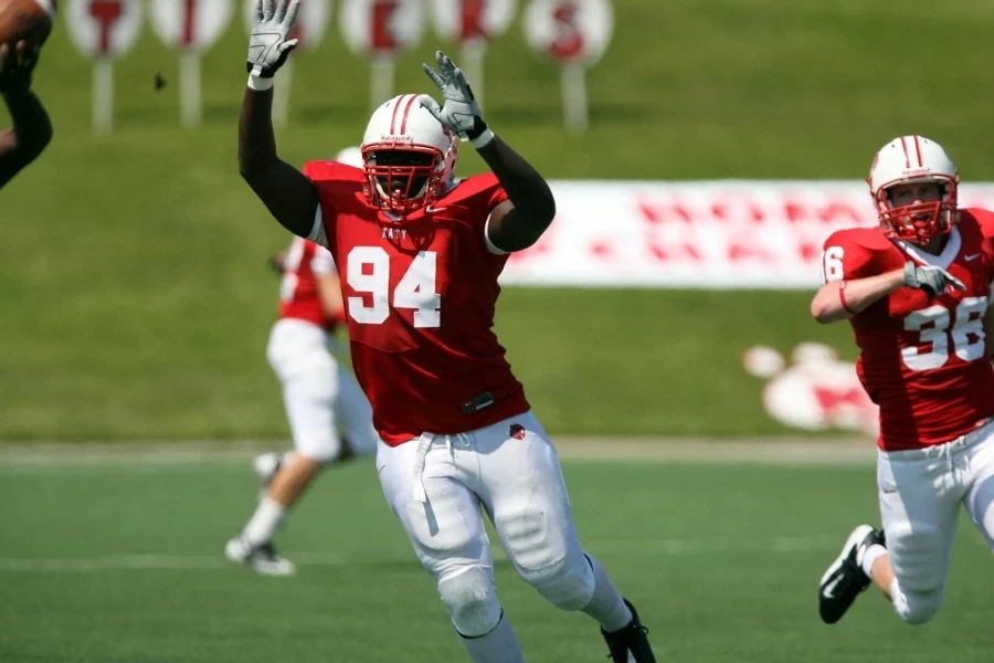 Athletes in action during an energetic American football game