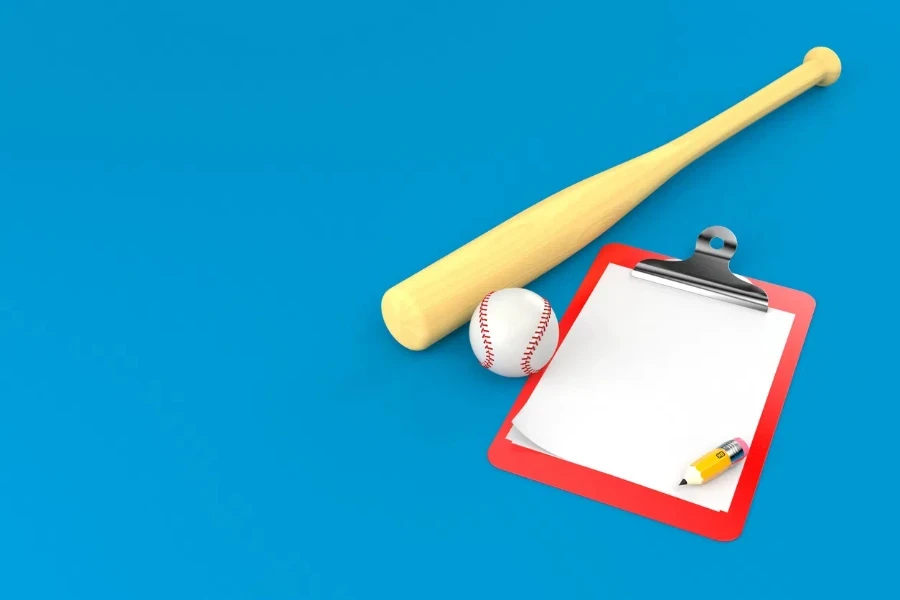 Baseball ball with blank clipboard isolated on blue background