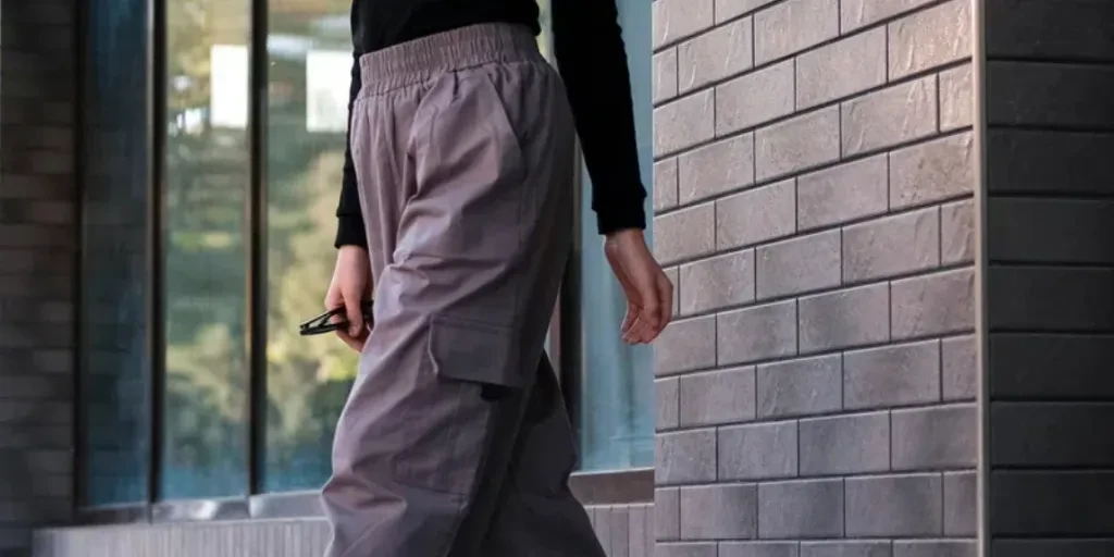 Beautiful teenage girl in stylish clothes on the street