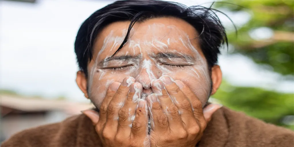 Close-Up Of Man Washing Face