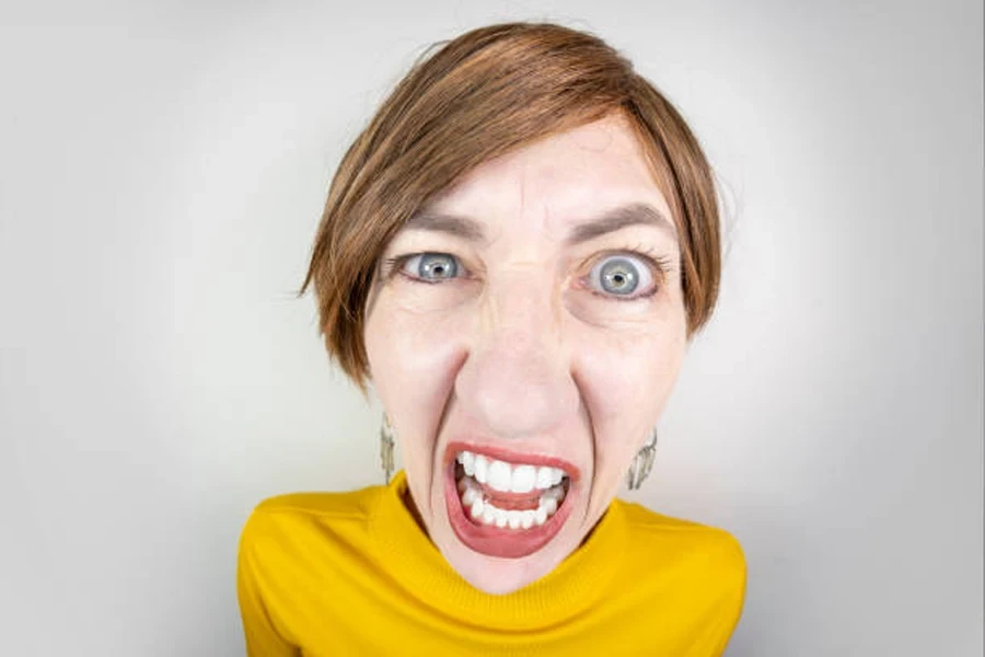 Close up of woman yelling with Karen haircut