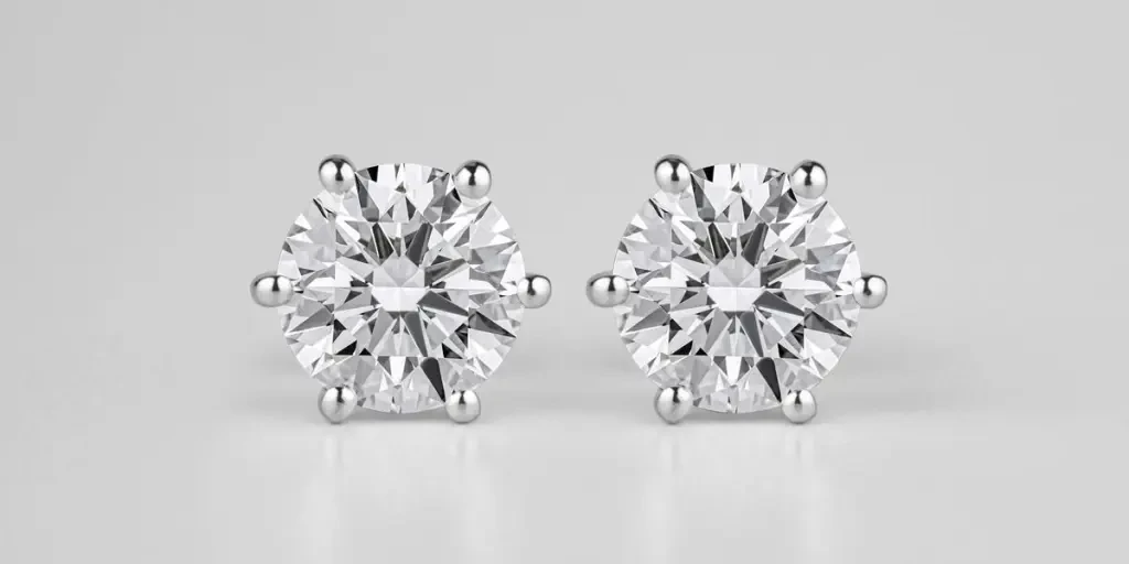 Elegant diamond stud earrings on a clean white background. Perfect for jewelry displays