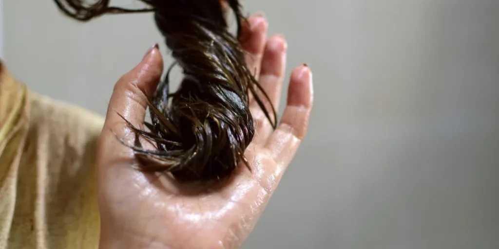 Female hand with dyed hair