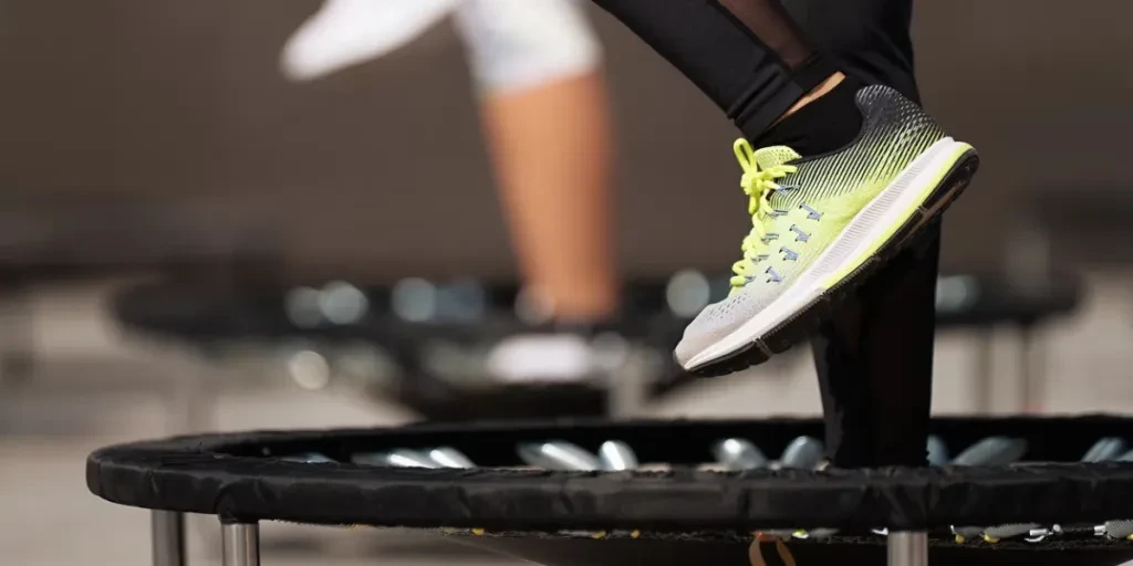 Fitness women jumping on small trampolines,exercise on rebounder