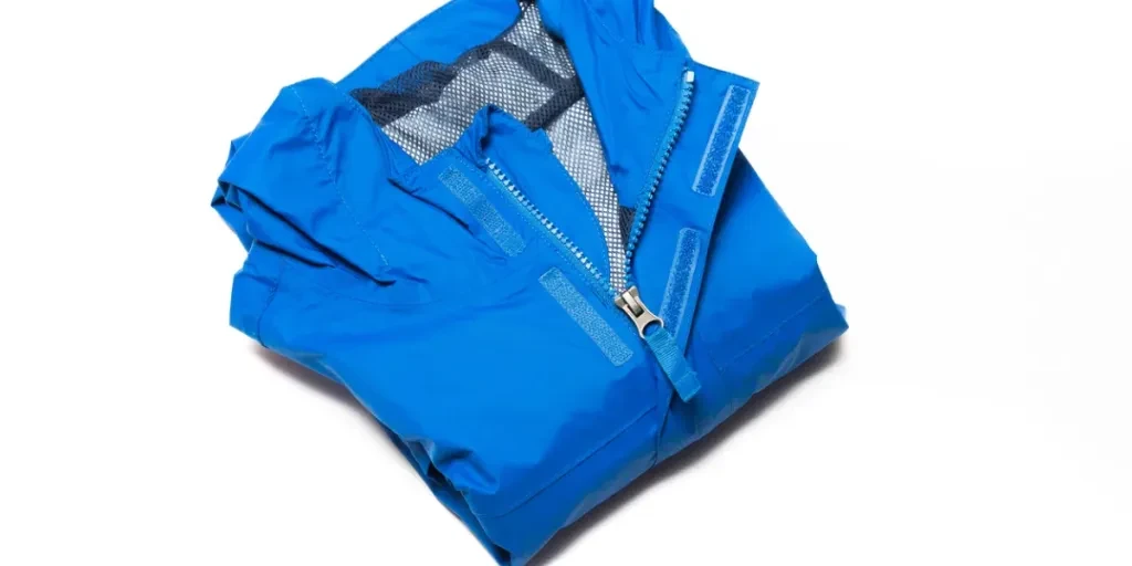 Folded blue zipper windbreaker jacket